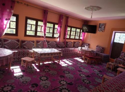 a living room with a couch and a table at Dar Atlas in Imlil