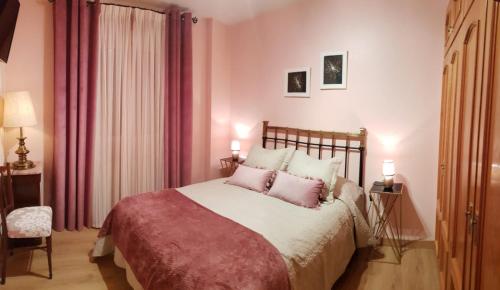 A bed or beds in a room at El Pasaje