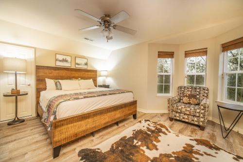 a bedroom with a bed and a ceiling fan at Thousand Hills Golf Resort in Branson