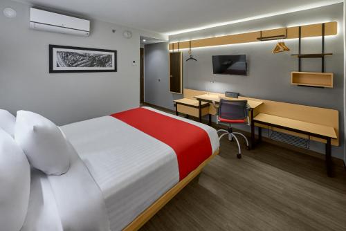 Ένα ή περισσότερα κρεβάτια σε δωμάτιο στο City Express by Marriott Caborca
