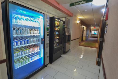 a vending machine in a store with drinks at Days Inn & Suites by Wyndham Airport Albuquerque in Albuquerque