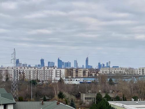 a view of a city skyline with tall buildings at Panoramic view apartments Warsaw West II in Warsaw