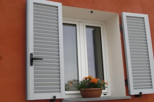 a window with a flower pot on a window sill at Villa Mont des Oliviers CITRA-8055LT-1805 e 1807 in Sanremo