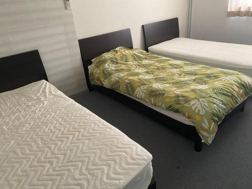 Un pat sau paturi într-o cameră la Oyado Sukeya
