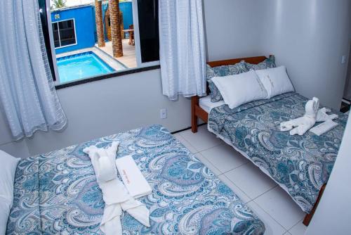 Ліжко або ліжка в номері Hotel Vila das Dunas Cumbuco