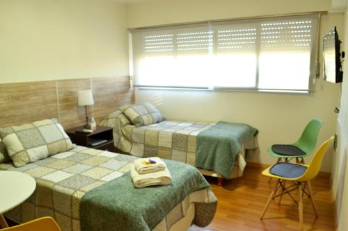 Un pat sau paturi într-o cameră la El Sueño de Teresita
