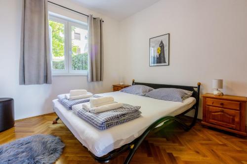 Postel nebo postele na pokoji v ubytování Apartments ALEX