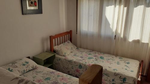 En eller flere senge i et værelse på Amaneceres en Punta mogotes