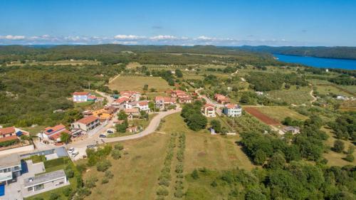 an aerial view of a small village with houses and a road at Villa Lenoir in Vrsar