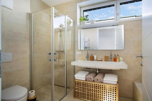 A bathroom at Naturpark Chalets Lambrecht by ALPS RESORTS