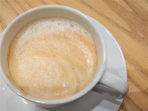 a cup of coffee on a plate on a table at Green Rich Hotel Nagoya Nishiki (Artificial hot spring Futamata Yunohana) in Nagoya