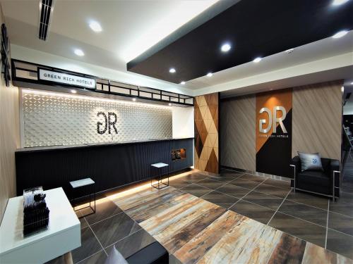 a salon with chairs and a sign on the wall at Green Rich Hotel Nagoya Nishiki (Artificial hot spring Futamata Yunohana) in Nagoya