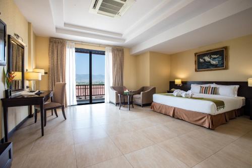 Ένα ή περισσότερα κρεβάτια σε δωμάτιο στο Leaves Valley Resort