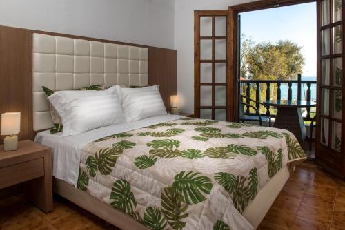 Ένα ή περισσότερα κρεβάτια σε δωμάτιο στο Georgalas Sun Beach Resort