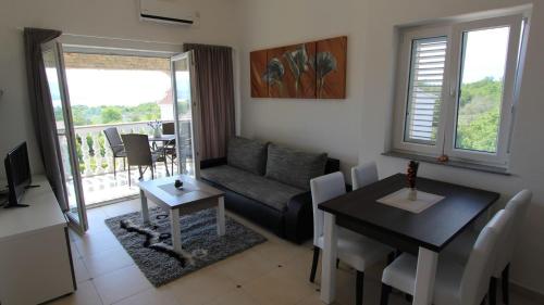 A seating area at Apartments Jela