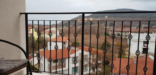 a balcony with a view of a building at Aparthotel Olympus Plaza - SPA & Indoor Pool in Kranevo