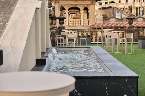 a pool of water on the roof of a building at Abba San Sebastián Hotel in Donostia-San Sebastián