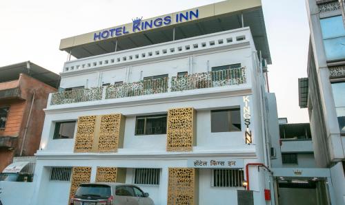 a white building with a sign that reads hotel kings inn at Treebo Kings Inn Vashi in Mumbai