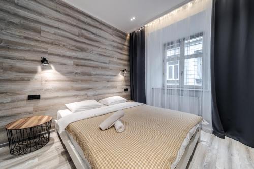Ein Bett oder Betten in einem Zimmer der Unterkunft Staroevreyska Apartment B