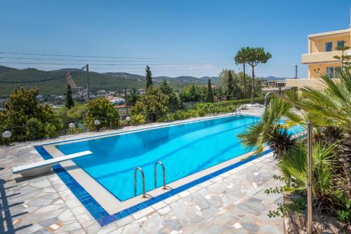 a swimming pool in a villa with a view at Villa Barite in Sounio