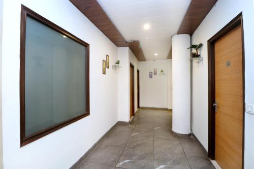 a hallway with a large screen on the wall at Hotel Seven- Center of City Chandigarh in Chandīgarh