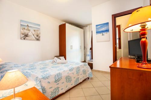 Ένα ή περισσότερα κρεβάτια σε δωμάτιο στο Villino Il Veliero