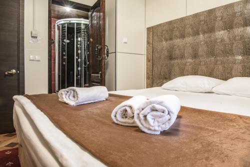 a hotel room with two towels on a bed at Hotel Strogino Expo in Moscow
