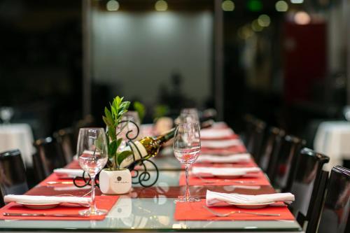 a long table with red napkins and wine glasses at Sapa Valley view hotel in Sa Pa