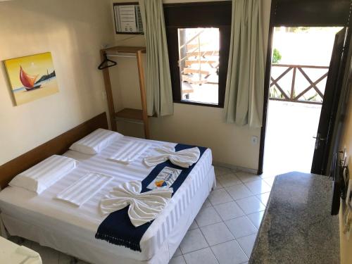 Ένα ή περισσότερα κρεβάτια σε δωμάτιο στο Apart Hotel Litoral Sul