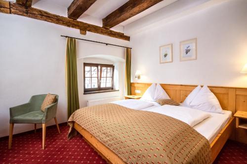 Een bed of bedden in een kamer bij Hotel Kartause
