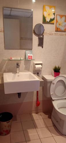 a bathroom with a sink and a toilet at Cozy Master Room at Suria Kipark Damansara Apartment Homestay Sleeps 3 in Kepong