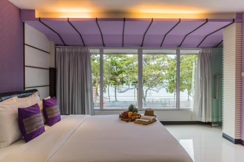 Säng eller sängar i ett rum på The L Resort, Krabi