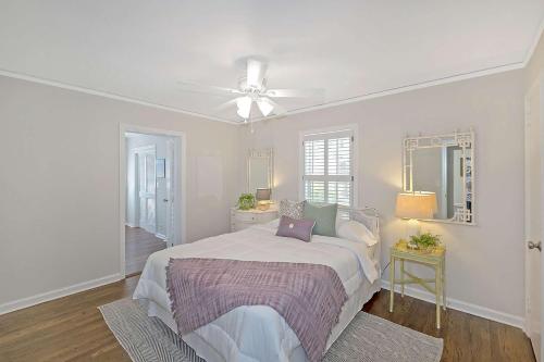 a white bedroom with a bed and a ceiling fan at South Perry St in Lawrenceville