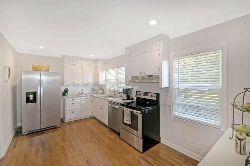 a kitchen with stainless steel appliances and white cabinets at South Perry St in Lawrenceville