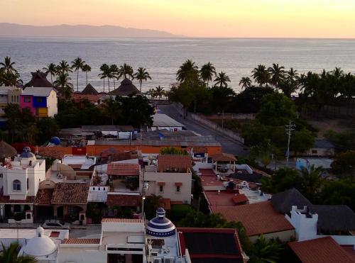 an aerial view of a town with the ocean at Aventura Pacifico Boutique Suites & Villas in Bucerías