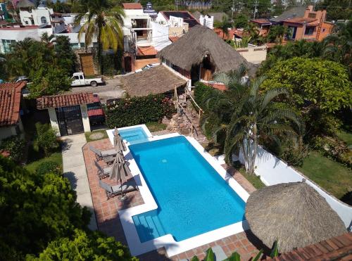 an overhead view of a swimming pool in a resort at Aventura Pacifico Boutique Suites & Villas in Bucerías
