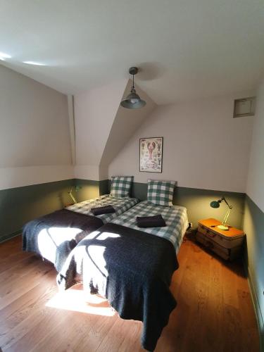 a bedroom with a large bed in a room at Il Etait Une Fois in Pierrefonds