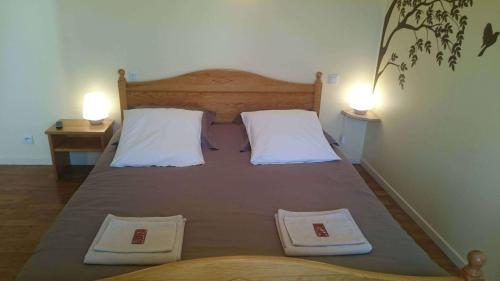 Katil atau katil-katil dalam bilik di Chambres d'hôtes de l'Auberge L'Astrassadou