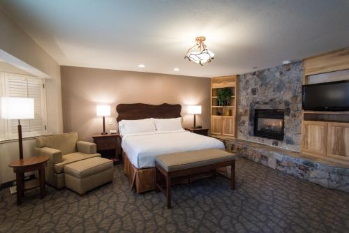 a hotel room with a bed and a fireplace at Holiday Inn Express South Lake Tahoe, an IHG Hotel in South Lake Tahoe