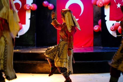 a person dancing on a stage with a basket on their head at Anitas Hotel in Konaklı