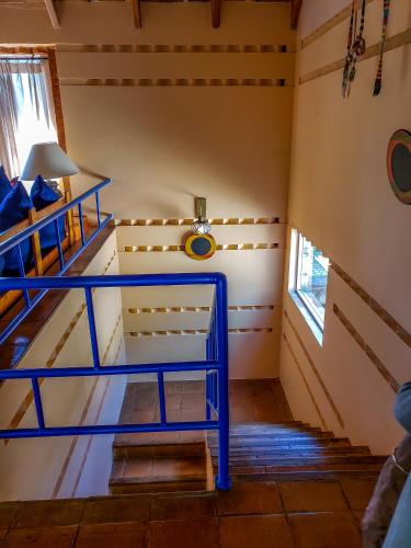 a room with a bunk bed and a window at Hotel San Buenaventura de Atitlán in Panajachel