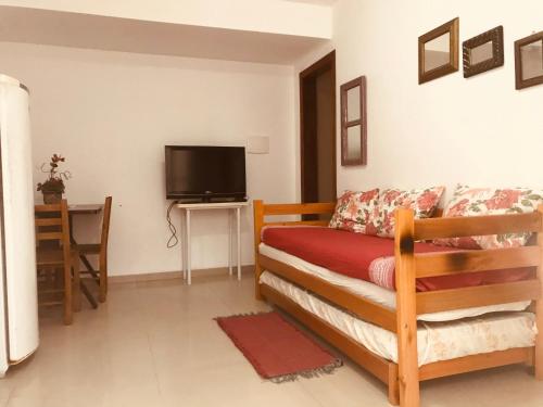 TV a/nebo společenská místnost v ubytování Residencial Vila Sassari