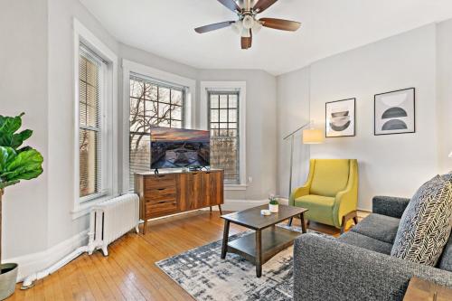 a living room with a couch and a table at Comfy 2BR Apartment near Wrigley Field - Grace 3 in Chicago