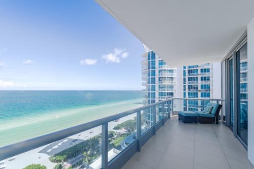 a balcony with a view of the ocean at Bluebird Suites Monte Carlo Miami Beach in Miami Beach