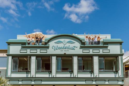 a group of people standing on the top of a building at Wanderlust NZ in Tauranga