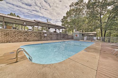 a large swimming pool in the middle of a yard at Unwind Fireside Ozark Mtn Condo with Resort Perks! in Branson