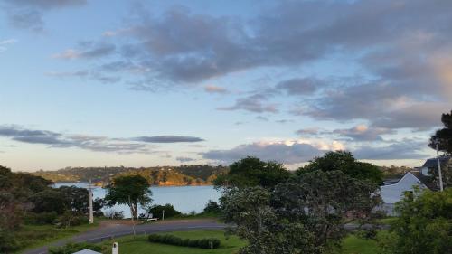 a view of a lake from a house at Jake's Place Oneroa Waiheke in Oneroa