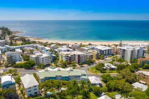 an aerial view of a city and the beach at Kings Bay Apartments in Caloundra