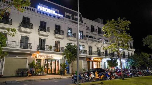 a white building with motorcycles parked in front of it at NEW CITY HOTEL in Tây Ninh