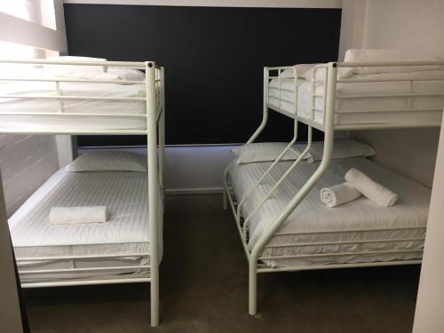 two bunk beds in a small room at Hima 8 in Mount Buller